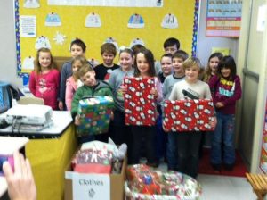 children pose with christmas gifts from Worcester County Gold MD